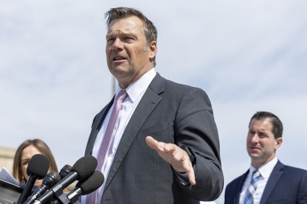 FILE - Kansas Attorney General Kris Kobach speaks to the media, March 26, 2024, in Washington. A group of Republican-led states filed a federal lawsuit Thursday, March 28, suing the Biden administration to block a new student loan repayment plan that provides a faster path to cancellation and lower monthly payments for millions of borrowers. Kobach argues that Biden overstepped his authority in creating the SAVE Plan, which was made available to borrowers last year and has already canceled loans for 150,000. (AP Photo/Amanda Andrade-Rhoades, File)