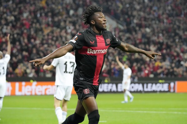 FILE - Leverkusen's Edmond Tapsoba celebrates after he scored his side's 5th goal during the UEFA Europa League Group H soccer match between Bayer Leverkusen and Qarabag at the BayArena in Leverkusen, Germany, Thursday, Oct. 26, 2023. Burkina Faso is bidding for its first Africa Cup of Nations title after one final and two semifinal appearances since 2013. Thanks to his assured cool-headed performances, Edmond Tapsoba finished on the team of the tournament as Burkina Faso was only stopped by eventual winner Senegal in the semifinals two years ago. (AP Photo/Martin Meissner, File)