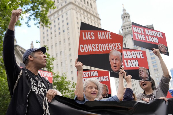 People react to the guilty verdict announced against former President Donald Trump outside Manhattan Criminal Court, Thursday, May 30, 2024, in New York. Donald Trump became the first former president to be convicted of felony crimes as a New York jury found him guilty of 34 felony counts of falsifying business records in a scheme to illegally influence the 2016 election through hush money payments to a porn actor who said the two had sex. (AP Photo/Julia Nikhinson)