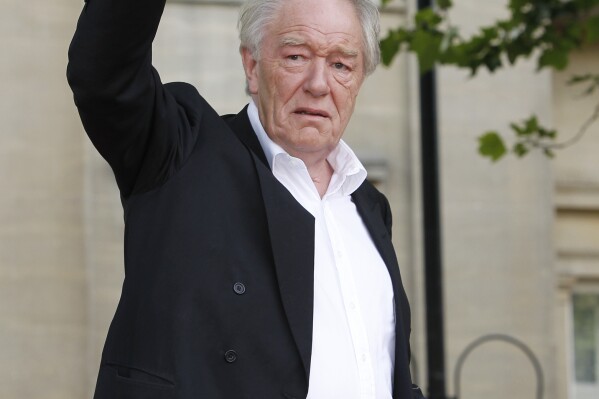 FILE - Actor Michael Gambon arrives in Trafalgar Square, in central London, for the World Premiere of Harry Potter and The Deathly Hallows: Part 2, the last film in the series, Thursday, July 7, 2011. Actor Michael Gambon, who played Dumbledore in the later Harry Potter films, has died at age 82, his publicist says. (AP Photo/Joel Ryan, File)