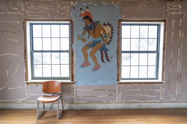 A mural sits on display in a room that was being renovated before the schools closure at Bacone College, on Jan. 8 2024, in Muskogee, Okla. Founded in 1880 as a Baptist missionary college focused on assimilation, Bacone College transformed into an Indigenous-led institution that provided an intertribal community, as well as a degree. (AP Photo/Nick Oxford)