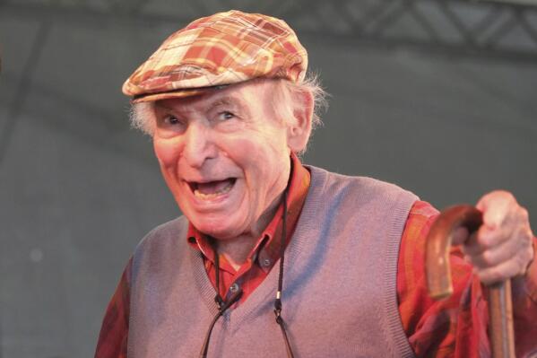 FILE - In this Aug. 4, 2013, file photo, Newport Jazz Festival producer and founder George Wein appears on stage at the Newport Jazz Festival in Newport, R.I. Wein, an impresario of 20th century music who helped found the Newport Jazz and Folk festivals and set the template for gatherings everywhere from Woodstock to the south of France, died Monday, Sept. 13, 2021. He was 95. (AP Photo/Joe Giblin, File)