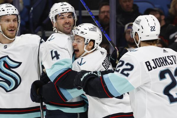 Seattle Kraken center Yanni Gourde (37) celebrates his goal with defenseman Justin Schultz (4) during the second period of an NHL hockey game against the Buffalo Sabres, Tuesday, Jan. 10, 2023, in Buffalo, N.Y. (AP Photo/Jeffrey T. Barnes)
