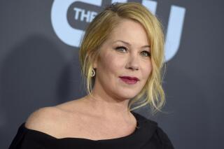 FILE - Christina Applegate arrives at the 25th annual Critics' Choice Awards on Jan. 12, 2020, in Santa Monica, Calif. Applegate has announced that she has multiple sclerosis, describing her diagnosis as a “tough road.” The 49-year-old actor known for her roles in “Married... with Children” and “Dead to Me,” said in a tweet late Monday that she was diagnosed “a few months ago.” (Photo by Jordan Strauss/Invision/AP, File)