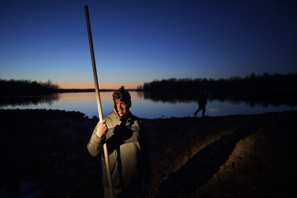 John Baker holds a spear while getting ready for a night of fishing at the Chippewa Flowage on the Lac Courte Oreilles Reservation, Sunday, April 14, 2024, near Hayward, Wis. Spearfishing is a traditional Ojibwe method of harvesting fish such as walleye in the spring when the fish venture to shallow waters in the evening to spawn. (ĢӰԺ Photo/John Locher)