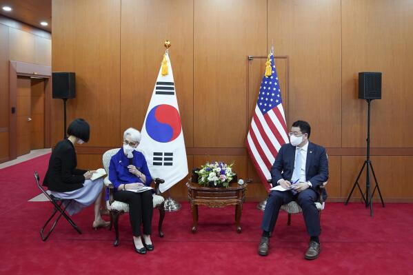 In this photo provided by South Korea Foreign Ministry, U.S. Deputy Secretary of State Wendy Sherman, second from left, talks to journalists as South Korean First Vice Foreign Minister Choi Jong Kun listens after their meeting at the Foreign Ministry in Seoul, South Korea, Friday, July 23, 2021. America's No. 2 diplomat on Friday expressed sympathy for North Koreans facing hardships and food shortages linked to the pandemic, and renewed calls for the North to return to talks over its nuclear program. (South Korea Foreign Ministry via AP)