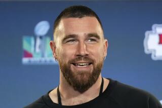 FILE - Kansas City Chiefs tight end Travis Kelce smiles as he listens to a question during an NFL football media availability in Scottsdale, Ariz., on Feb. 9, 2023. Kelce announced Tuesday that he’ll host his first-ever festival called “Kelce Jam” during NFL Draft weekend. (AP Photo/Ross D. Franklin, File)