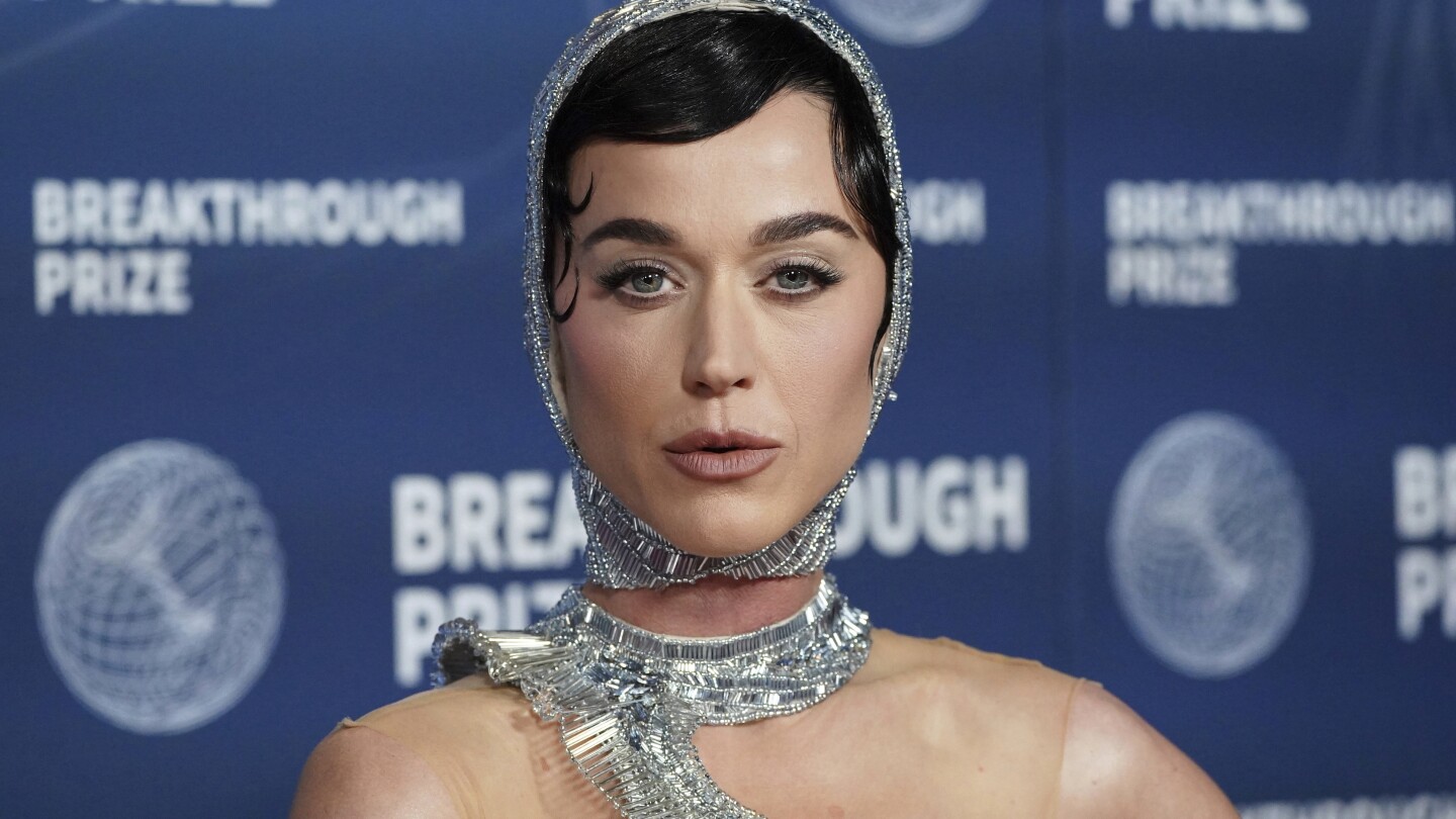 Ahead of spaceflight, Katy Perry is reading Carl Sagan and channeling her 'feminine divine'