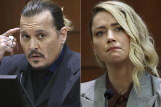 This combination of photos shows actor Johnny Depp testifying at the Fairfax County Circuit Court in Fairfax, Va., on April 21, 2022, left, and actor Amber Heard testifying in the same courtroom on May 26, 2022.  Heard notified a Virginia court Thursday, July 21,  that she will appeal the $10.35 million judgment she was ordered to pay Depp during a high-profile defamation trial that exposed the inner workings of their troubled marriage. (AP Photo)