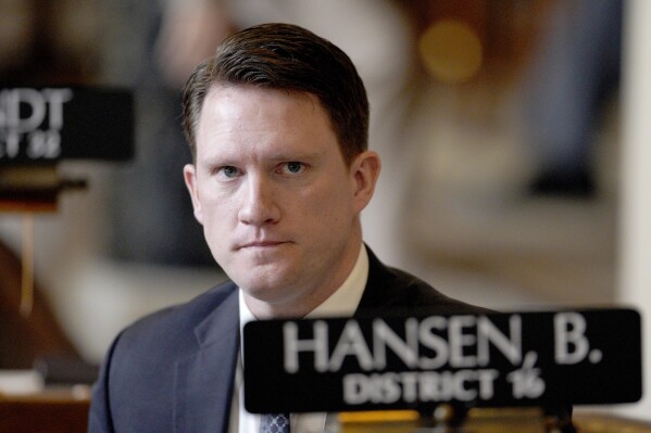 FILE - Nebraska state Sen. Ben Hansen, of Blair, sits in the Legislative Chamber in Lincoln, Neb., Friday, March 1, 2019. It didn't take long for conservative Nebraska lawmakers to get to the point of a committee hearing held Wednesday, Nov. 1, 2023, on a legislative study to examine the effectiveness of of public health safety policies during the height of the COVID-19 pandemic. Hansen, the Health and Human Services Committee chairman and a chiropractor from eastern Nebraska, asked among other things how nurses felt about mask requirements. (AP Photo/Nati Harnik, File)