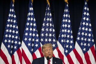 FILE- In this July 24, 2020, file photo President Donald Trump speaks during an event to sign executive orders on lowering drug prices, in the South Court Auditorium in the White House complex in Washington. Trump is working overtime to solidify his image as a champion regulation-cutter in the leadup to the November election. (AP Photo/Alex Brandon, File)