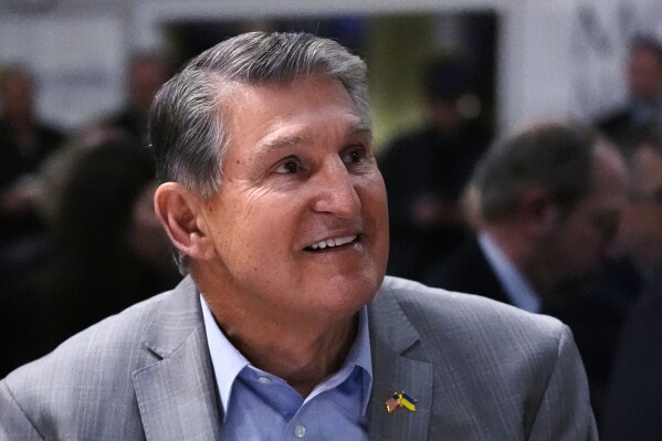 FILE - Sen. Joe Manchin, D-W.Va., smiles while being introduced during the 'Politics and Eggs' event, as part of his national listening tour, Friday, Jan. 12, 2024, in Manchester, N.H. As his second term ends as a U.S. senator, Manchin is still not a declared candidate for any office five months before the 2024 general election. But there’s still time to mull potential runs for governor, the Senate, and even the U.S. presidency. (AP Photo/Charles Krupa, File)