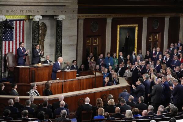 President Donald Trump speaks as Vice President JD Vance, from left, and House Speaker Mike Johnson, R-La., stand and clap as Trump addresses a joint session of Congress at the Capitol in Washington, Tuesday, March 4, 2025. (AP Photo/Alex Brandon)
