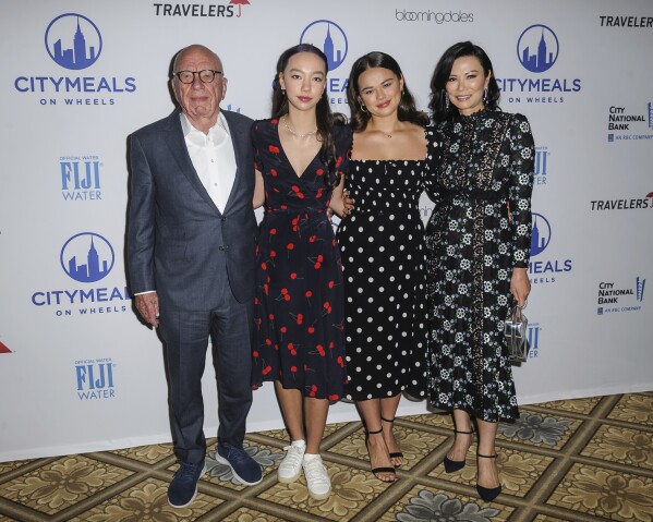 FILE - Rupert Murdoch, from left, Chloe Murdoch, Grace Murdoch and Wendi Deng Murdoch attend the Citymeals on Wheels 33rd annual Power Lunch for Women at The Plaza Hotel, Tuesday, Nov. 19, 2019, in New York. (Photo by Christopher Smith/Invision/AP, File)