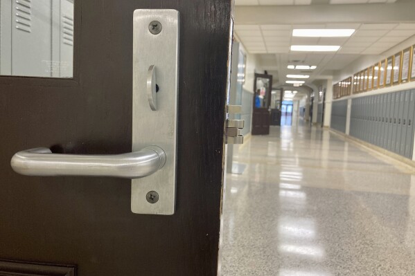 The hallway is empty at Baton Rouge Magnet High School on Jan. 30, 2023 in Baton Rouge, La. America’s Black and Latino students are at a disadvantage in nearly every measure of educational opportunity, with less access to advanced classes, counselors and even certified teachers, according to data released Wednesday, Nov. 15, by the U.S. Education Department. (AP Photo/Stephen Smith, file)