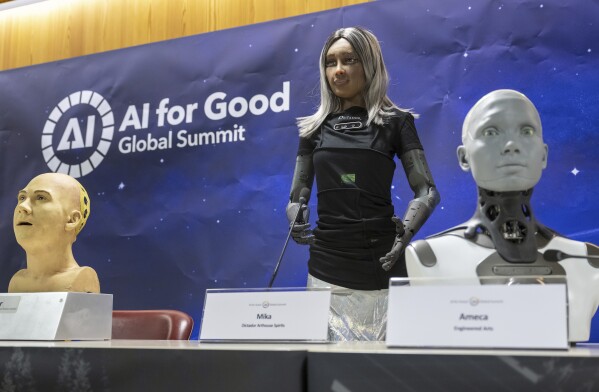 AI-powered humanoid robots field questions from reporters