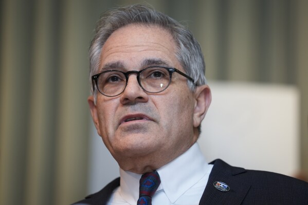 Philadelphia District Attorney Larry Krasner speaks in Philadelphia, Thursday, Jan. 11, 2024. The nearly 3,500 people exonerated of crimes in the U.S. since 1989 have now collected $4 billion in compensation. But it's rare for any individuals to be held accountable. Krasner hopes to prove that three retired detectives perjured themselves at a now-exonerated man's retrial in 2016. (AP Photo/Matt Rourke)