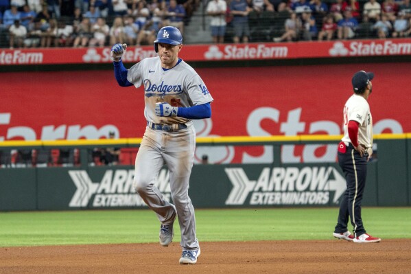 Freeman hits 2 of the Dodgers' 5 HRs as they rout the Rangers 16-3 in  matchup of division leaders