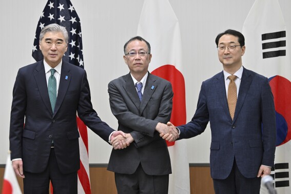 From left, U.S. Special Representative for North Korea Sung Kim, Japan's Ministry of Foreign Affairs Director General for Asian and Oceanian Affairs Takehiro Funakoshi, and South Korea's Special Representative for Korean Peninsula Peace and Security Affairs Kim Gunn pose prior to their talks on the North Korean situation in Karuizawa, Nagano prefecture, Japan Thursday, July 20, 2023. (Kazuhiro Nogi/Pool Photo via AP)