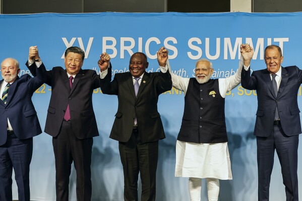 From left, Brazil's President Luiz Inacio Lula da Silva, China's President Xi Jinping, South Africa's President Cyril Ramaphosa, India's Prime Minister Narendra Modi and Russia's Foreign Minister Sergei Lavrov pose for a BRICS group photo during the 2023 BRICS Summit at the Sandton Convention Centre in Johannesburg, South Africa, Wednesday, Aug. 23, 2023. (Gianluigi Guercia/Pool via AP)