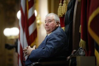 FILE - In this Oct. 30, 2019, file photo, Republican Ohio state Rep. Larry Householder sits at the head of a legislative session as Speaker of the House, in Columbus. Householder's name will be on the ballot Nov. 3, 2020, as the disgraced lawmaker intends to serve his district for another term despite facing federal bribery charges for his alleged involvement in a $60 million bribery scheme that shook the Statehouse this summer and led his party to remove him from the House speaker role. (AP Photo/John Minchillo, File)