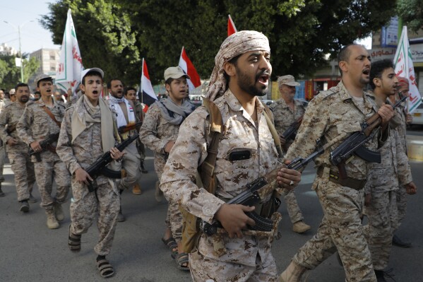 Houthi supporters march marking the anniversary of Yemeni unity in Sanaa, Yemen, Wednesday, May 22, 2024. (AP Photo/Osamah Abdulrahman)