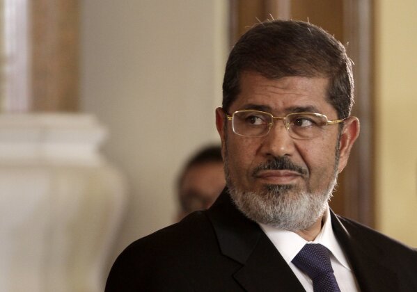 FILE - In this July 13, 2012 photo, Egyptian President Mohammed Morsi holds a news conference with Tunisian President Moncef Marzouki, at the Presidential palace in Cairo, Egypt. On Monday, June 17...