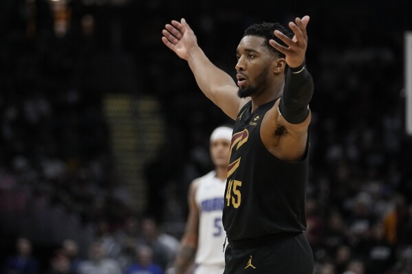 Cleveland Cavaliers guard Donovan Mitchell gestures to the crowd in the second half of Game 7 of an NBA basketball first-round playoff series against the Orlando Magic, Sunday, May 5, 2024, in Cleveland. (AP Photo/Sue Ogrocki)