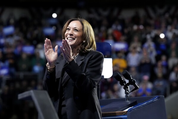 Democratic presidential nominee Vice President Kamala Harris claps on stage during a campaign rally at Erie Insurance Arena, in Erie, Pa., Monday, Oct. 14, 2024. (AP Photo/Jacquelyn Martin)