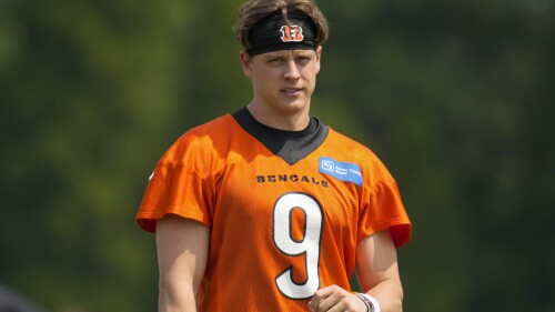 FILE - Cincinnati Bengals quarterback Joe Burrow (9) takes part in a drill during practice at the team's NFL football training facility, Tuesday, June 6, 2023, in Cincinnati. Burrow has reported to training camp amid negotiations for a long-term contract with the team that's expected to make him one of the NFL's highest paid players.(AP Photo/Jeff Dean, File)