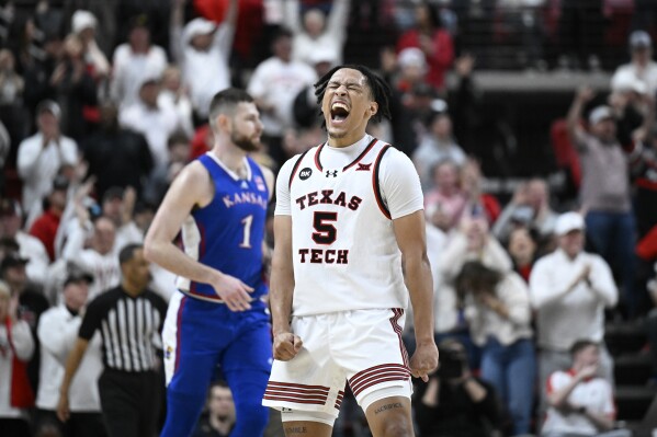 Texas Tech guard Darrion Williams (5) reacts after a score against Kansas during the second half of an NCAA college basketball game, Monday, Feb. 12, 2024, in Lubbock, Texas. (AP Photo/Justin Rex)