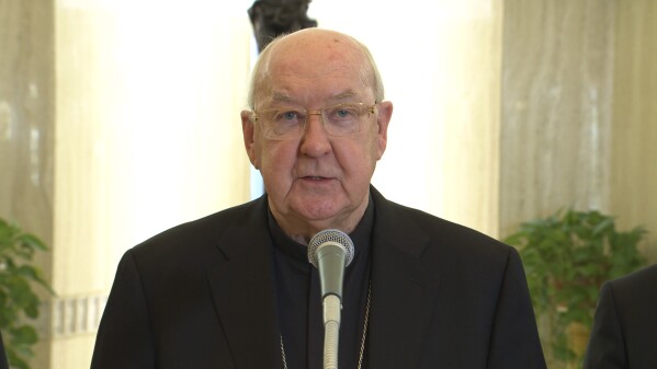 In this image released by Vatican media on Monday, April 21, 2025, Cardinal Camerlengo Kevin Joseph Farrell announces the death of Pope Francis at the Vatican. (Vatican Media via AP)