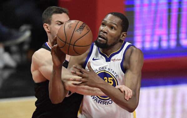 
              Golden State Warriors forward Kevin Durant, right, is fouled by Los Angeles Clippers forward Danilo Gallinari during the second half in Game 6 of a first-round NBA basketball playoff series Friday, April 26, 2019, in Los Angeles. The Warriors won 129-110. (AP Photo/Mark J. Terrill)
            