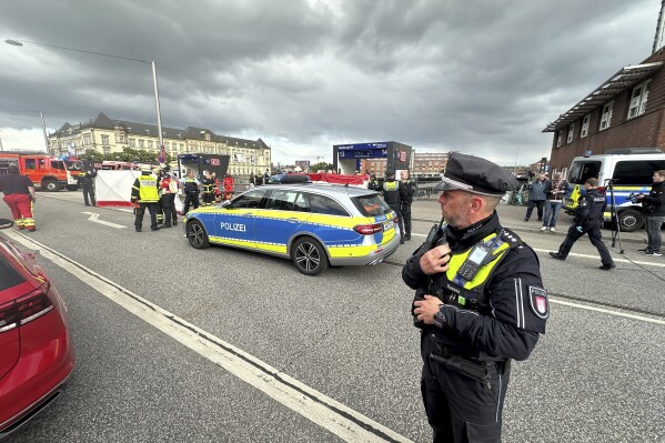 Police at the scene of a stabbing at Hamburg Central Station in Hamburg, Germany, Friday, May 23, 2025. (Steven Hutchings/dpa via AP)