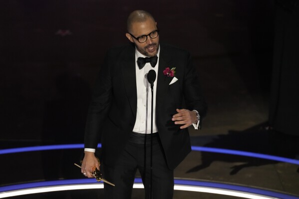 Cord Jefferson accepts the award for best adapted screenplay for "American Fiction" during the Oscars on Sunday, March 10, 2024, at the Dolby Theatre in Los Angeles. (AP Photo/Chris Pizzello)