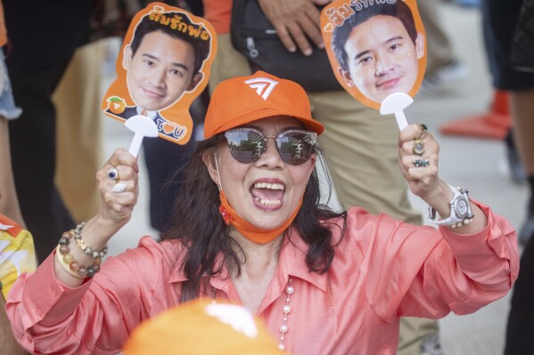 Supporters of Move Forward Party shout outside parliament during vote counting, in Bangkok, Thailand, Thursday, July 13, 2023. Pita, whose Move Forward Party ran first in Thailand's May 14 general election, was nominated to be prime minister at a joint session of Parliament's Upper and Lower House on Thursday, but failed to attain the majority vote needed to win the job, necessitating a new round of voting expected next week. (AP Photo/Wason Wanichakorn)