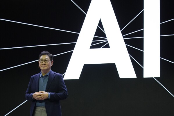JH Han, CEO and Head of the Device Experience Division at Samsung Electronics, speaks during a Samsung press conference ahead of the CES tech show Monday, Jan. 8, 2024, in Las Vegas. (AP Photo/John Locher)
