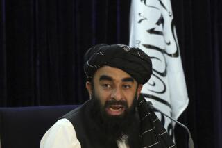 FILE - Taliban spokesman Zabihullah Mujahid speaks during a press conference in Kabul, Afghanistan Tuesday, Sept. 7, 2021. The top Taliban official on Wednesday, Nov. 10, has urged former Afghan military pilots to remain in the country, saying they are protected by a national amnesty and would not face arrest. (AP Photo/Muhammad Farooq, File)