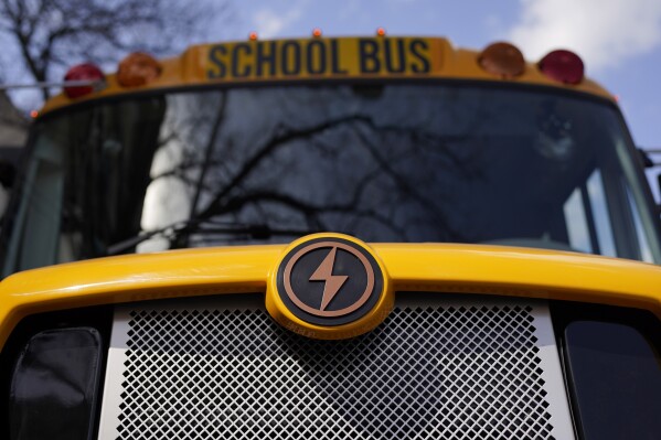FILE - A Lion electric school bus is seen on display in Austin, Texas, Feb. 22, 2023. The Transportation Department is awarding almost $1.7 billion in grants for buying zero and low emission buses, with the money going to transit projects in 46 states and territories. The grants will enable transit agencies and state and local governments to buy 1,700 U.S.-built buses, nearly half of which will have zero carbon emissions. (AP Photo/Eric Gay, File)