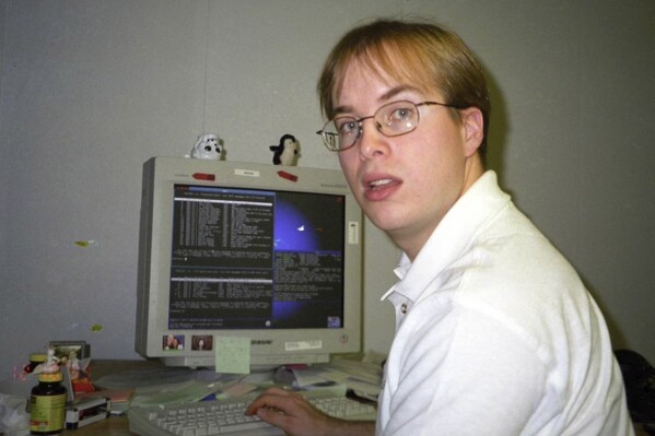 Paul Buchheit, the former Google engineer who created Gmail, works at the company's offices in Mountain View, Calif., in Dec. 10, 1999. Buchheit was the 23rd employee hired at Google, a company that now employs more than 180,000 people. (April Buchheit via AP)