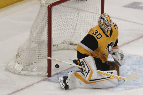 A shot by Washington Capitals' Nic Dowd gets past Pittsburgh Penguins goaltender Matt Murray for a goal during the first period of an NHL hockey game, Saturday, March 7, 2020, in Pittsburgh. (AP Photo/Keith Srakocic)