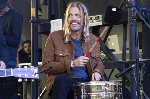 FILE - Musician Taylor Hawkins appears at One Love Malibu in Calabasas, Calif., on Dec. 2, 2018. Foo Fighters will honor the rock band’s late drummer Taylor Hawkins with a pair of tribute concerts in September — one in London and the other in Los Angeles. The twin shows will take place Sept. 3 at London’s Wembley Stadium and Sept. 27 at The Kia Forum in Los Angeles. Hawkins died March 25, 2022, during a South American tour with the rock band. He was 50. (Photo by Amy Harris/Invision/AP, File)
