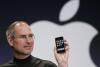 FILE - Apple CEO Steve Jobs holds up an Apple iPhone at the MacWorld Conference in San Francisco on Jan. 9, 2007. The iPhone introduced the convenience of touchscreens at the time that a physical keyboard was still all the rage on the top-selling smartphone – the BlackBerry – when Jobs first took out what was all-in-one computer, camera and music player out of his pocket in 2007. (AP Photo/Paul Sakuma, File)