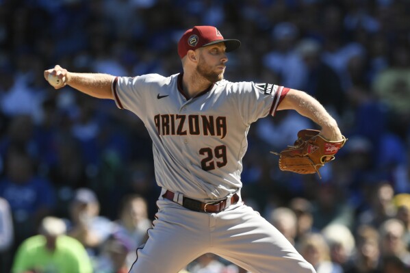 Arizona Diamondbacks starter Merrill Kelly delivers a pitch during the first inning of a baseball game against the Chicago Cubs Saturday, Sept. 9, 2023, in Chicago. (AP Photo/Paul Beaty)