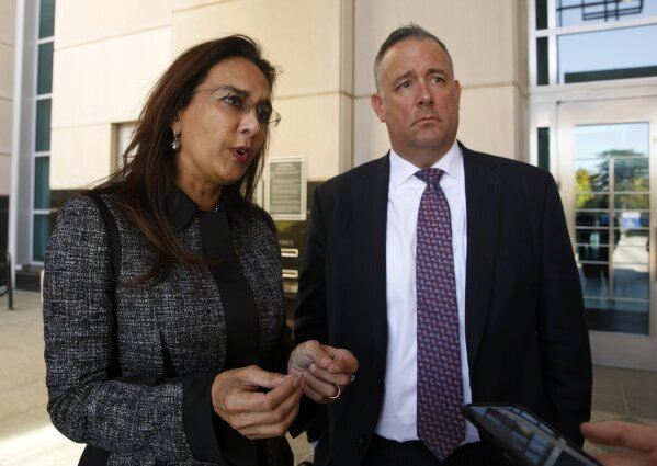 Attorneys Harmeet Dhillon, left , and Justin Clark who represented the state and national Republican parties, discuss the tentative ruling by a federal judge to halt a California law that's aimed at forcing the president to release his tax returns, in Sacramento, Calif., Thursday, Sept. 19, 2019. U.S.District Judge Morrison England Jr., said the will issue a formal ruling by Oct. 1. (AP Photo/Rich Pedroncelli)