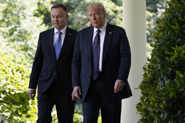 FILE - President Donald Trump and Polish President Andrzej Duda walk from the Oval Office for a news conference in the Rose Garden of the White House, June 24, 2020, in Washington. Trump is set to meet with Polish President Andrzej Duda in New York as Trump's criminal trial takes a one-day break. Their planned dinner Wednesday comes as European leaders prepare for the possibility Trump might win the White House in November. (AP Photo/Evan Vucci, File)
