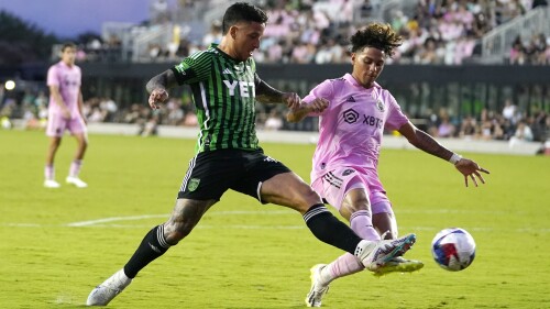 Austin FC forward Sebastián Driussi, left, attempts shot on the goal past Inter Miami midfielder David Ruiz, right, during the first half of an MLS soccer match Saturday, July 1, 2023, in Fort Lauderdale, Fla. (AP Photo/Lynne Sladky)