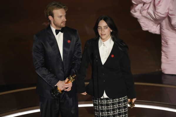 Finneas O'Connell, left, and Billie Eilish accept the award for best original song for "What Was I Made For?" from "Barbie" during the Oscars on Sunday, March 10, 2024, at the Dolby Theatre in Los Angeles. (AP Photo/Chris Pizzello)