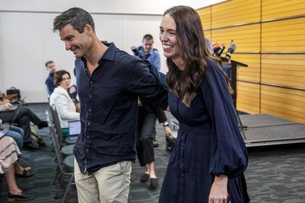 New Zealand Prime Minister Jacinda Ardern, right, with her fiancee Clark Gayford leave a press conference after announcing her resignation in Napier, New Zealand, Thursday, Jan. 19, 2023. Fighting back tears, Ardern told reporters that Feb. 7 will be her last day in office. (Mark MItchell/New Zealand Herald via AP)