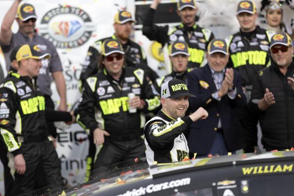 William Byron (24) celebrates with his team after winning a NASCAR Cup Series auto race on Sunday, March 5, 2023, in Las Vegas. (AP Photo/Ellen Schmidt)